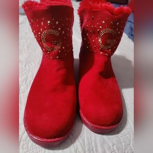 Red faux fur boots with gold accents